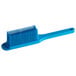 A blue silicone pastry brush with long bristles.