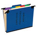 A blue Pendaflex file folder for employee records with colorful tabs.
