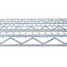 A close-up of a Metro Super Erecta wire shelf with a metal grid.