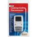 The white and grey Comark digital cooking thermometer in packaging.