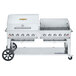 A large stainless steel Crown Verity mobile outdoor grill with a lid.