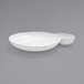 A bright white porcelain bowl with two compartments.