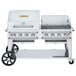 A large silver Crown Verity outdoor grill on wheels.