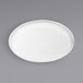A Front of the House bright white oval porcelain plate on a gray background.