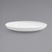 A Front of the House Harmony bright white porcelain plate with a small rim on a white background.