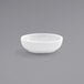 A Front of the House Harmony bright white round porcelain ramekin on a gray background.