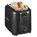 A Proctor Silex 2 slice toaster toasting bread.