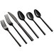 A close-up of several black Acopa Phoenix stainless steel spoons.