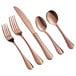 A close-up of a set of rose gold Acopa Vernon flatware, including a spoon, fork, and knife.