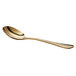 An Acopa Vernon gold stainless steel bouillon spoon with a long handle.