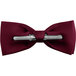 A close up of a burgundy Henry Segal clip-on bow tie.
