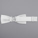 A white Henry Segal poly-satin bow tie with an adjustable band.