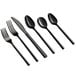 A group of black Acopa Phoenix stainless steel spoons and forks.