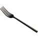 An Acopa Phoenix stainless steel dinner fork with a black handle.