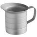 A silver metal measuring cup with a handle.