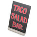 A stainless steel American Metalcraft table card holder with a black sign that says "Taco Salad Bar" in red.