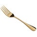 An Acopa Vernon gold stainless steel salad/dessert fork with a gold handle.