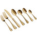 A close-up of a group of Acopa Vernon gold forks.