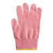 A pink Mercer Culinary Millennia Colors glove with yellow trim.