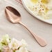 An Acopa Vernon rose gold stainless steel spoon in a bowl of mashed potatoes.