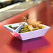 A table with a plate of food and a Front of the House Kyoto bright white porcelain bowl filled with shrimp and sauce.