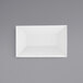 A white rectangular bowl on a grey background.