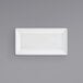 A white rectangular Front of the House Kyoto porcelain plate on a gray background.
