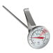 A Choice metal frothing thermometer with a red handle.