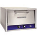 A stainless steel Bakers Pride countertop pizza and pretzel oven with blue knobs and buttons.