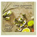 A Steep Cafe By Bigelow Citrus Chamomile tea bag with a lemon slice on a table.
