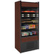 A Structural Concepts Oasis air curtain merchandiser with a shelf of drinks and beverages.