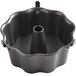 A black Wilton scalloped angel food cake pan with a metal ring.