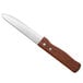 A Choice jumbo steak knife with a wooden handle.