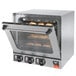 A Vollrath countertop convection oven with bread on a rack.