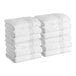 A stack of white Lavex Luxury bath towels.
