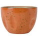 A Tuxton Artisan Geode Coral bouillon cup with a speckled design in orange.