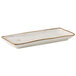 A rectangular white plate with gold trim.