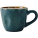 A blue china coffee cup with brown speckles.