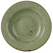 A Tuxton TuxTrendz wide rim china soup bowl with green and brown speckles.