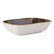 A white rectangular bowl with a brown and gold rim.