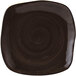 A square brown china plate with a black geode pattern on the rim.
