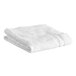 A folded white Lavex bath mat.