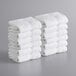 A stack of Lavex Premium white hand towels.