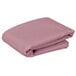 A pink Intedge square cloth table cover folded on a white background.