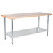 An Advance Tabco wood top work table with a galvanized undershelf.