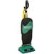 A black and green Bissell upright vacuum cleaner with a bag.