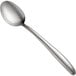 A close-up of a Tablecraft stainless steel serving spoon with a silver handle.