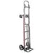 A white Magliner hand truck with four wheels and a handle.