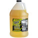 A white jug of Finest Call Lime Sour Mix concentrate with yellow liquid and a label.
