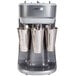 A silver and black Hamilton Beach triple spindle drink mixer.